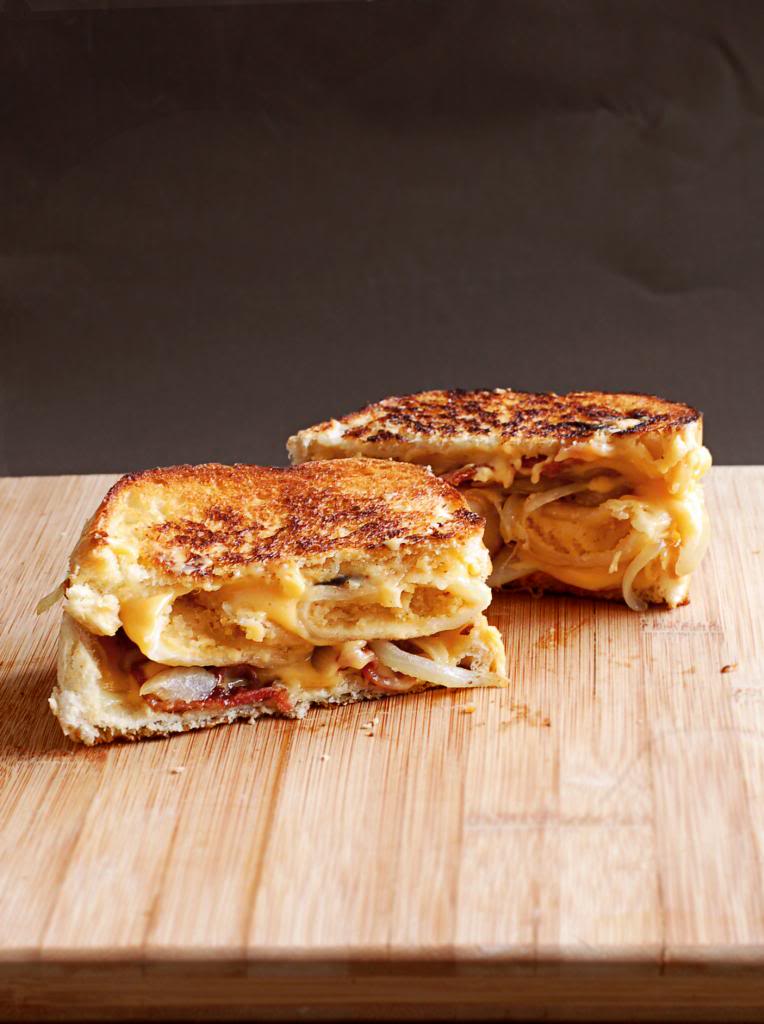 Grilled cheese sandwich being grilled in frying pan Stock Photo